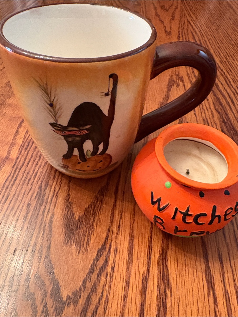 Black Cat Halloween Mug with Orange Accent and small candle